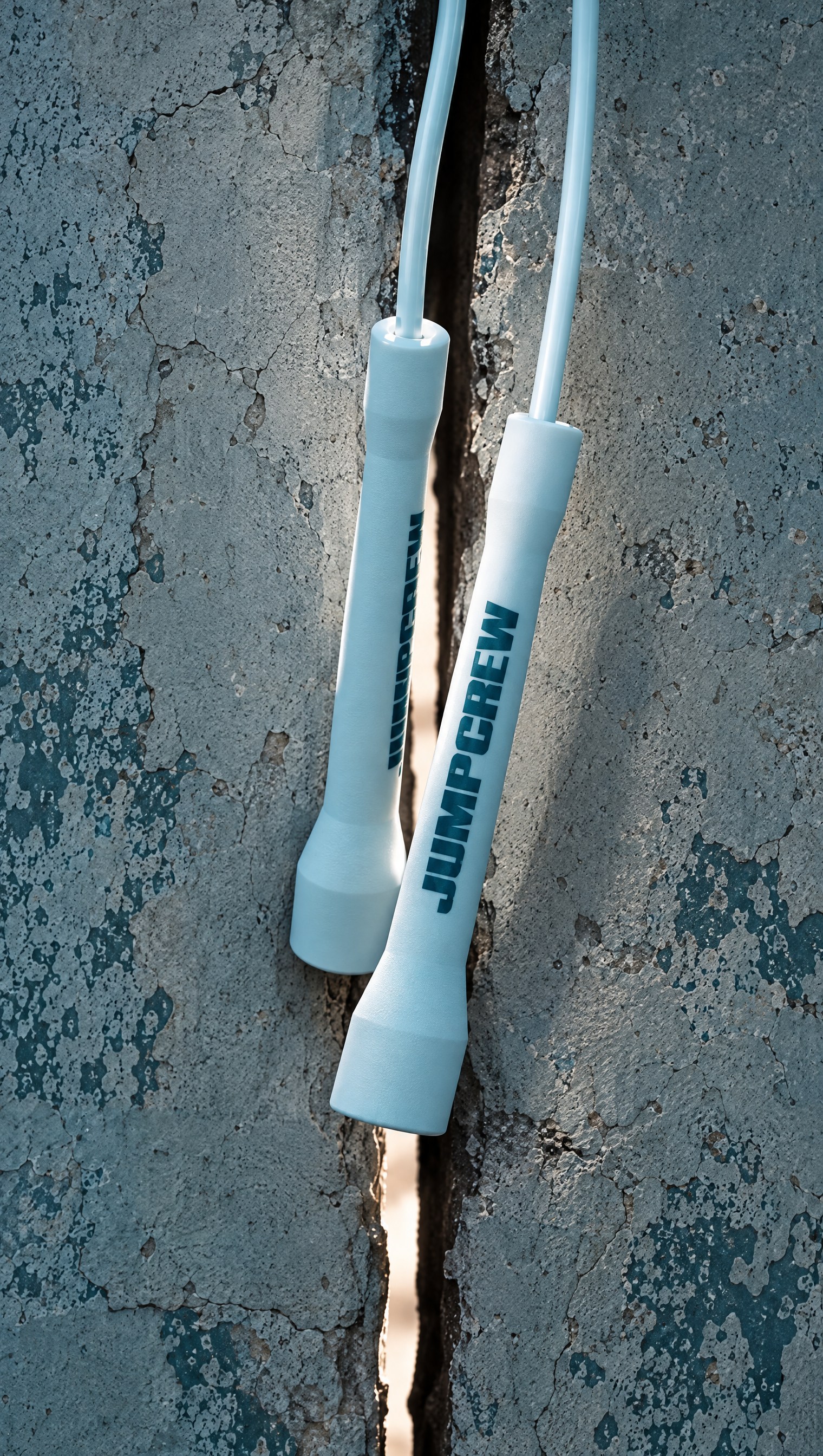JUMPCREW rope handles against textured concrete